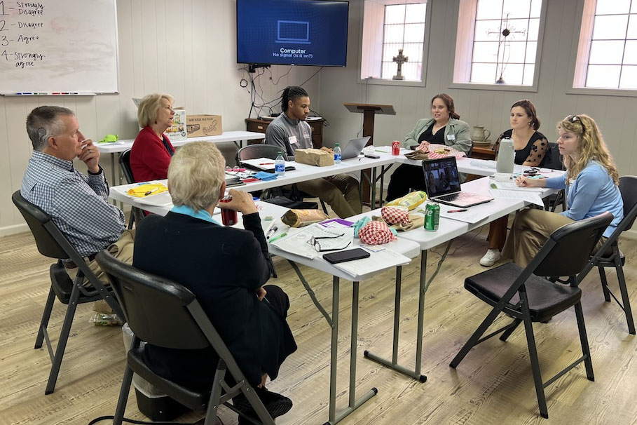 The CARE team meeting with faith leaders in rural communities