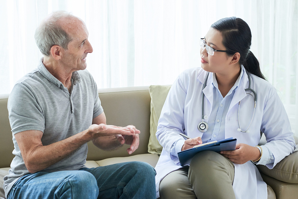 Man talking to a doctor.