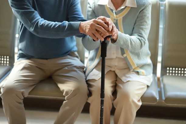 Older couple holding hands